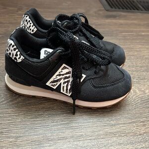 New Balance Kids Black Sneakers with White Zebra Accents